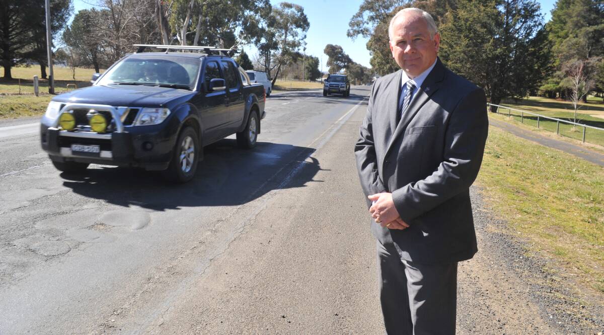 FIX THE ROADS: Cr Jeff Whitton has called for action to repair streets in Orange including the bumpy Forest Road. Photo: JUDE KEOGH 0901jkwhitton3