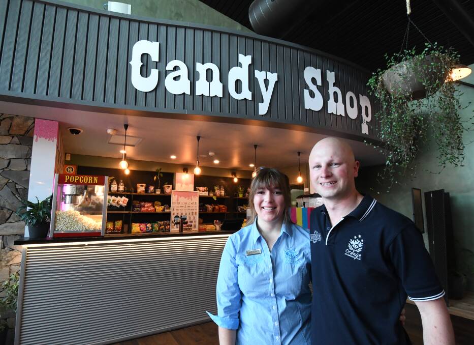MOVIE FOOD: OESC staff Kerry Crockett and Michael Rudd at the new candy shop.