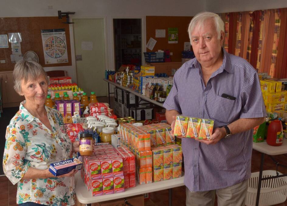 HELPING OUT: FoodCare's Anne Hopwood with Orange Cr Ron Gander. Photo; DECLAN RURENGA