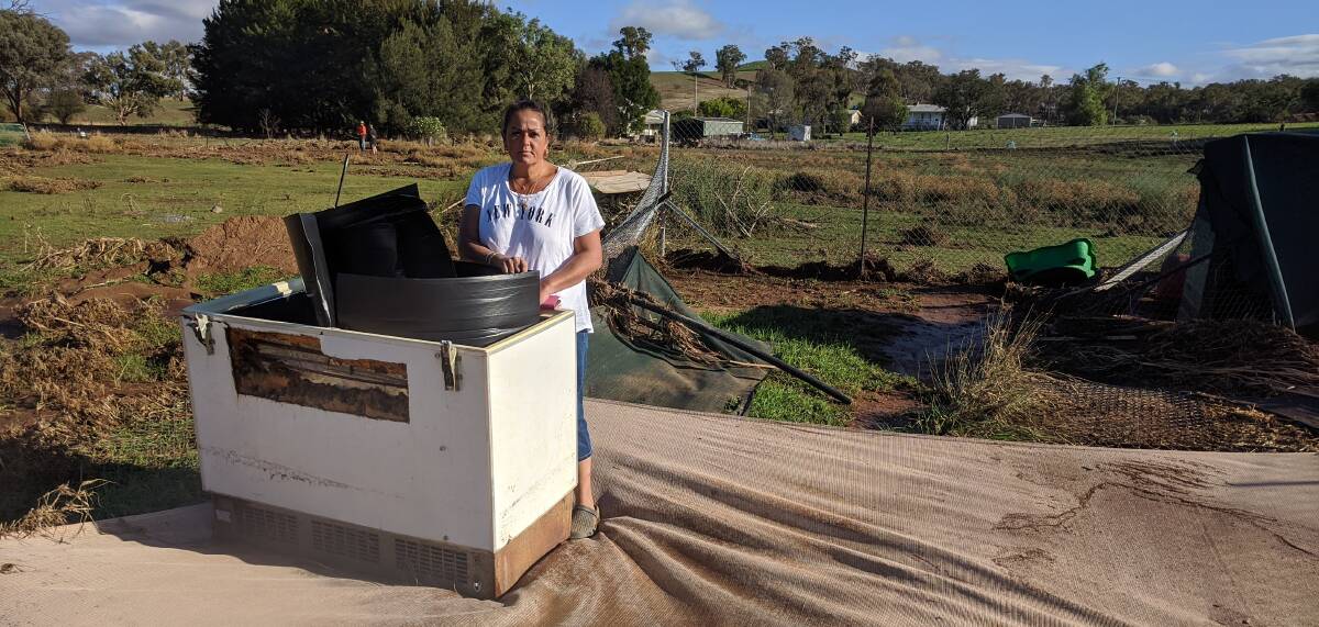 WIPED OUT: Trainer Amanda Ginn amid the mess left behind at the property where her dogs are kept after Tuesday night's wild storm lashed the region. Photo: Supplied