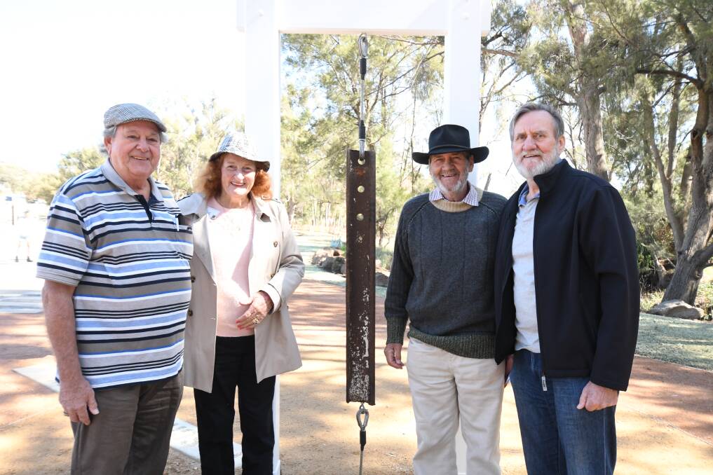 RING THAT BELL: Old Fairbridgians Ian Dean (a bell ringer), Maggie Maclauchlan, Jim (Tubby) Walker and Mike (Radish) Walker with the old Fairbridge Farm bell which is part of the new park's display. Photo: CARLA FREEDMAN
