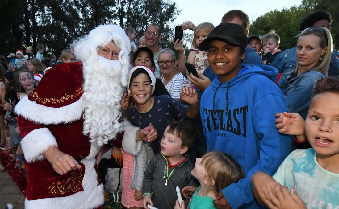 WAY WE WERE: Santa brought smiles to the children's faces at last year's Carols event in Orange. Photo: JUDE KEOGH