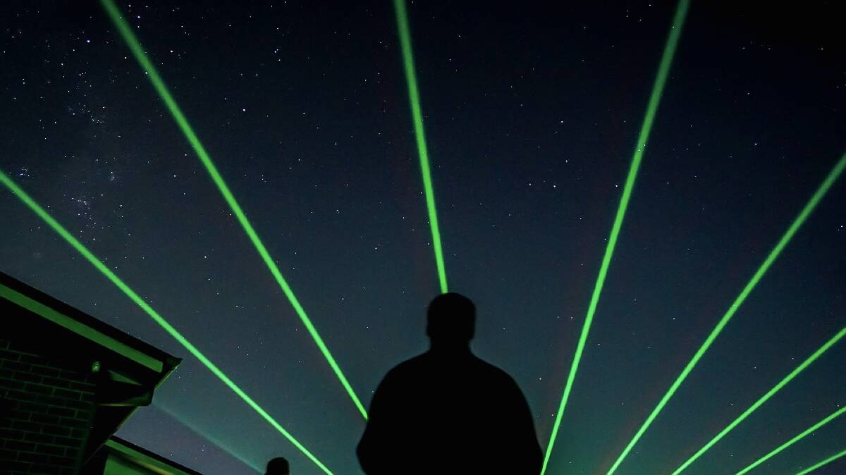 LIGHT IT UP: Lasers would illuminate the sky over Wade Park on New Year's Eve similar to this image from a previous event provided by the Sydney-based producers.