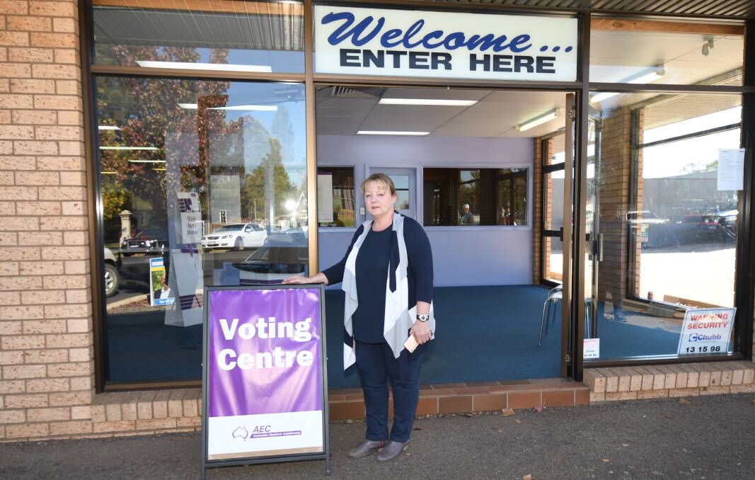 EARLY OPENER: Divisional returning officer Sandra Taylor at the front of the early voting centre which has been declared wheelchair inaccessible, partly because of the front step. Photo: CARLA FREEDMAN 0429cfprepoll6 