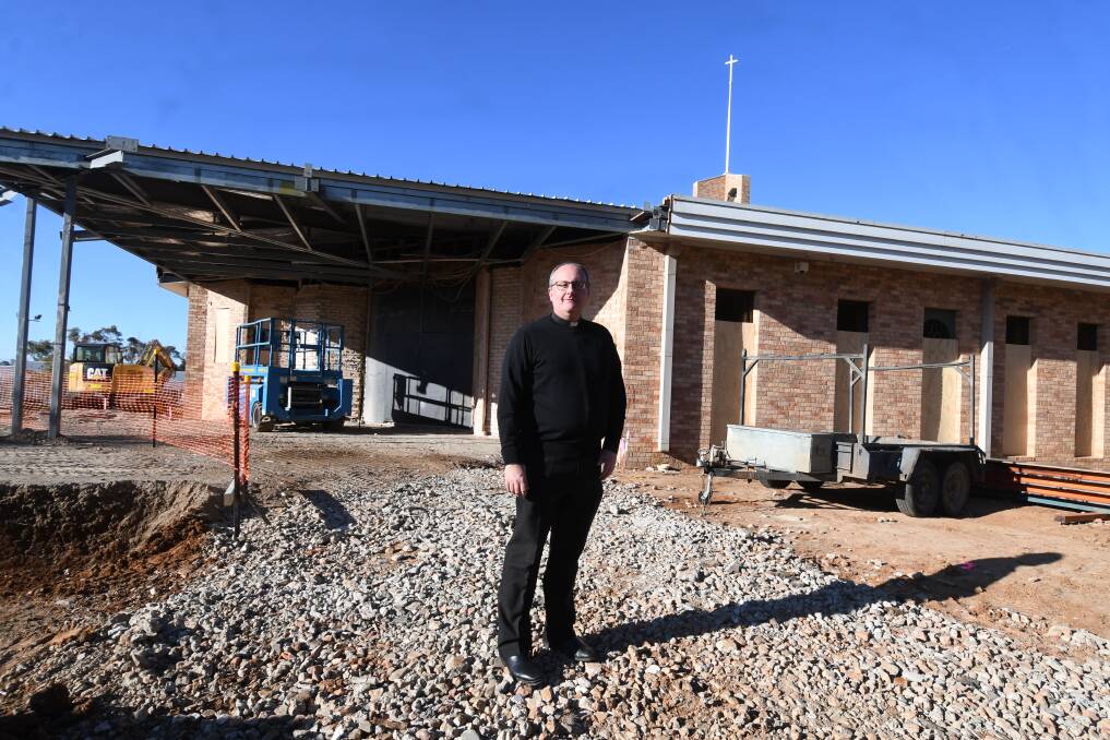 RENOVATIONS: Father Greg Bellamy at St Mary's church which has become a construction site. Photo: JUDE KEOGH