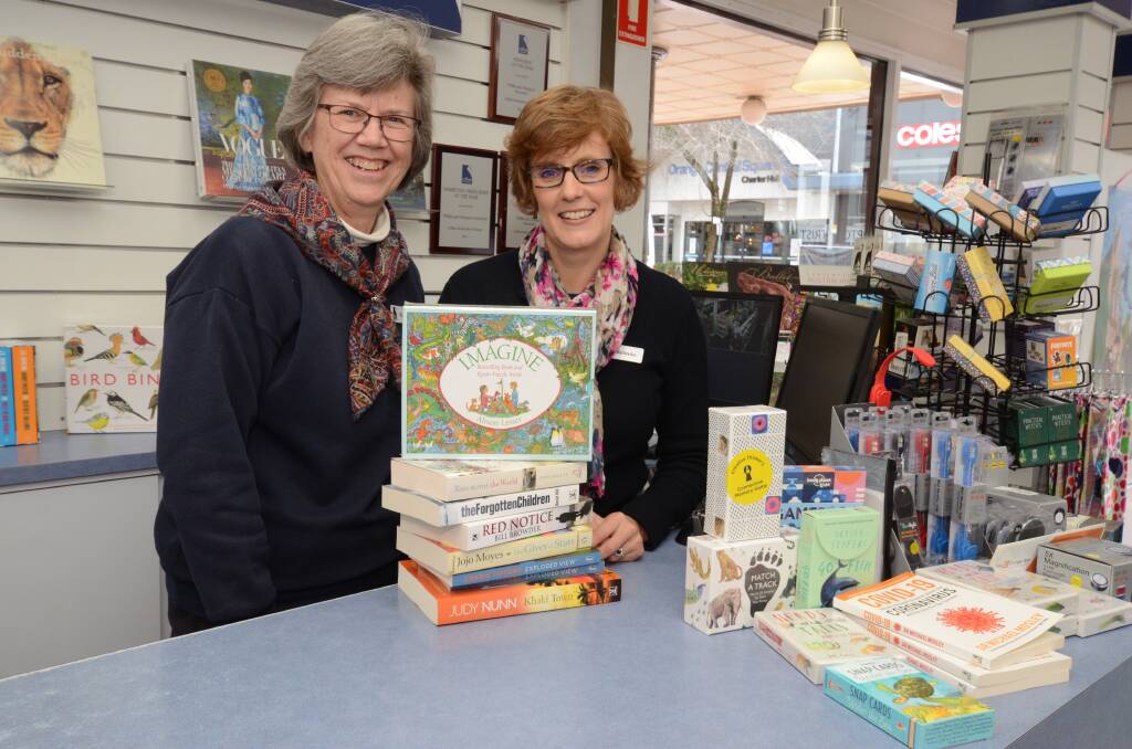 READ ABOUT IT: Margaret Schwebel and Belinda McCauley at Collins Booksellers Orange, which is registered as part of the Shop Orange gift card scheme. Photo: JUDE KEOGH
