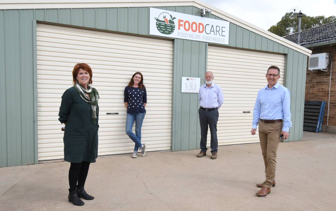 TIME OF NEED: Sue Clarke of Netwaste, Kate Hook from Futuring Orange, Nick King of ECCO and Foodcare supporter Simon Wright at the Foodcare centre in March Street. Photo: JUDE KEOGH