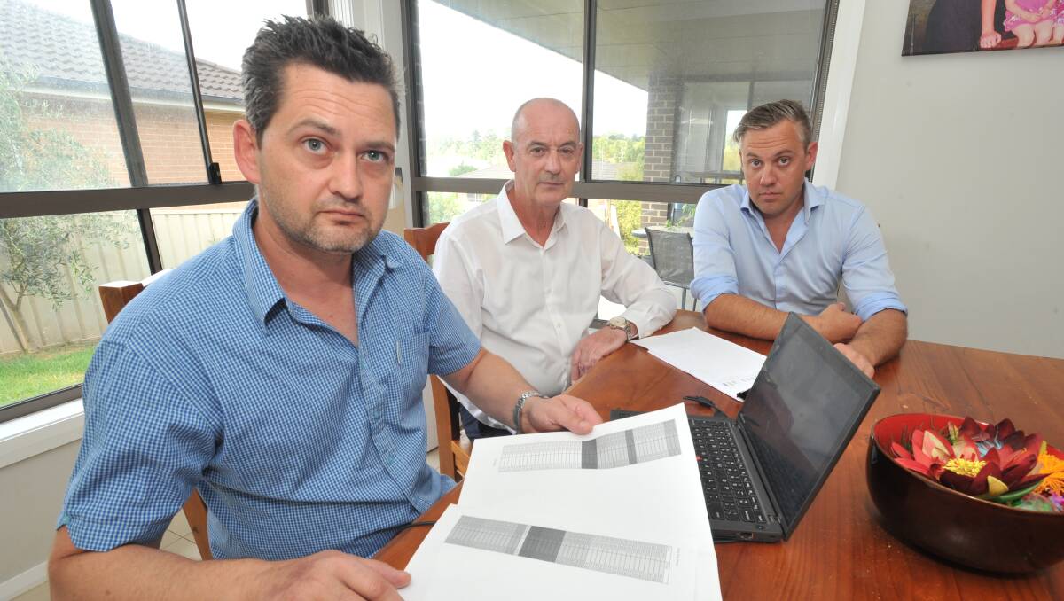 FED UP: Ben Sidlo discusses his internet woes with former Labor Orange byelection candidate Bernard Fitzsimon and concerned business owner Luke Sanger. Photo: JUDE KEOGH