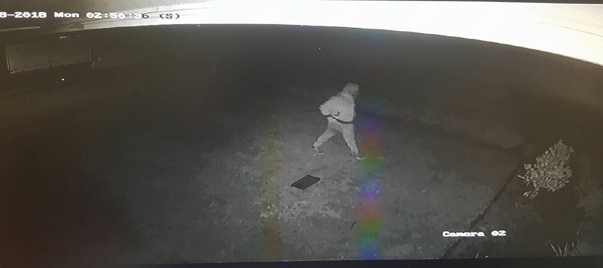 ON CAMERA: CCTV footage of a man walking across a lawn after allegedly entering a car in north Orange. Photo: Supplied