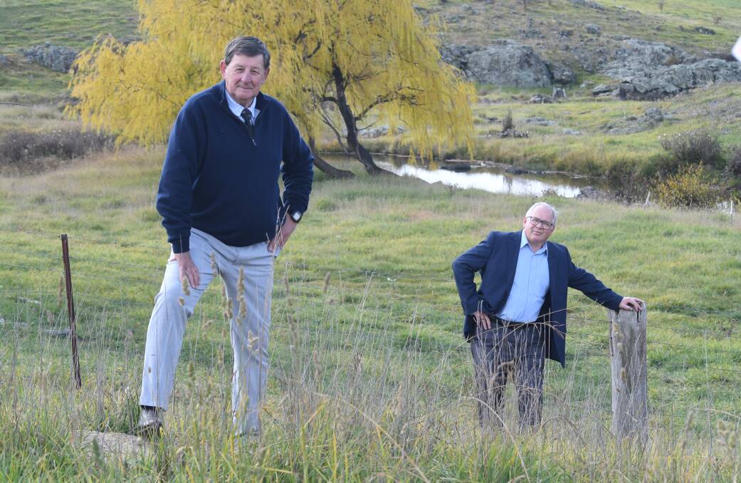 SOCIAL DISTANCING: Councillors Reg Kidd and Jeff Whitton have announced the Macquarie River inflows are boosting Orange's water supply. Photo: JUDE KEOGH