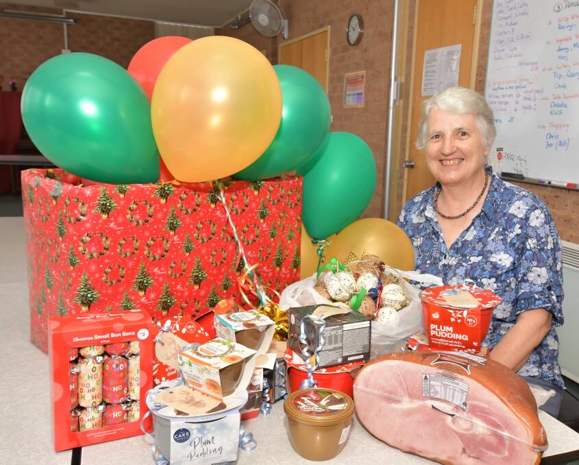 SEASONS GREETINGS: Bev Rankin is ready for the Christmas Day lunch and the ongoing hot meals programs. Photo: JUDE KEOGH