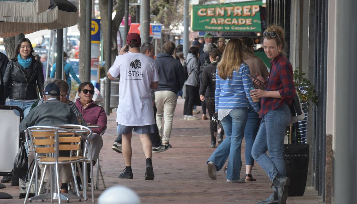 BUSY: Summer Street was buzzing with locals and visitors shopping and dining on Saturday with the CBD expected to get even busier later this month. Photo: JUDE KEOGH 