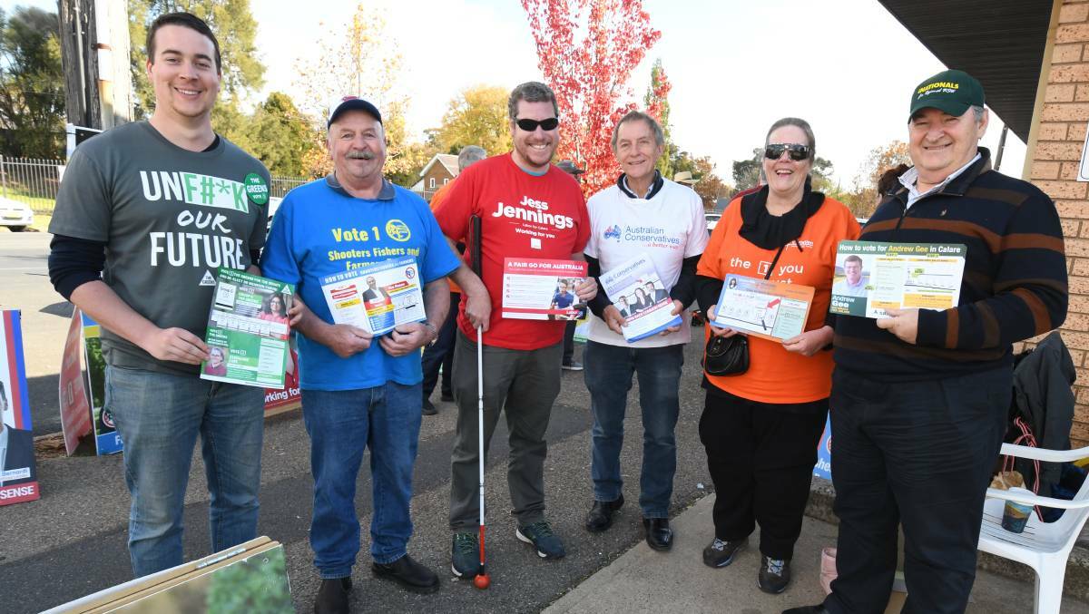 LONG TIME: Party volunteers handing out how to vote cards on the last day of pre-polling in Orange. The Greens' James Moreland, the Shooters' Andrew Barbagello, Labor's Joel Everett, the Australian Conservatives' Garry McMahon, the Christian Democrats' Heather Bocxe and The Nationals' Gordon Eggins. 