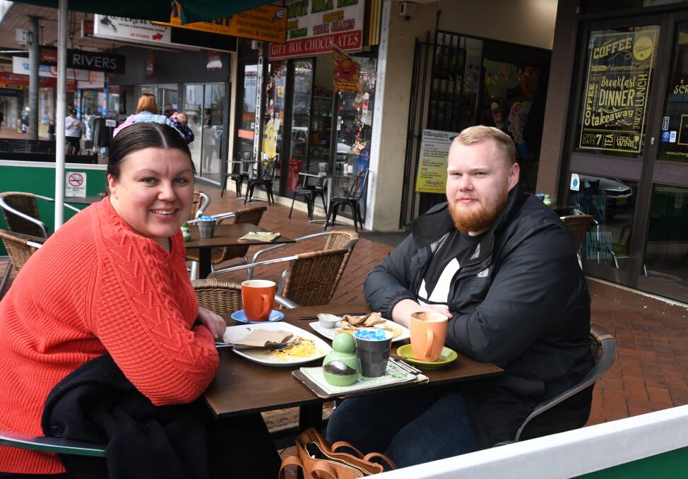 ECONOMY BOOST: Megan and Alex Campbell enjoy lunch at a cafe on Summer Street on Sunday. Photo: CARLA FREEDMAN 0616cfcafes1