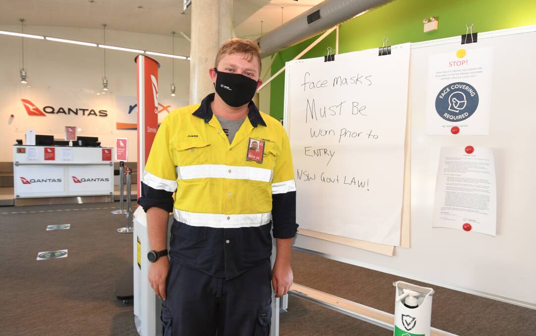 IT'S THE LAW: Orange Regional Airport manager Justin Bannon wearing a now compulsory face mask in the terminal. Photo: JUDE KEOGH