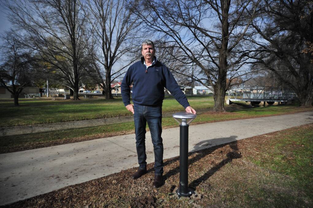 PROTECT THE PARK: Cr Glenn Taylor with one of the new solar lights in Matthews Park. Photo: CARLA FREEDMAN