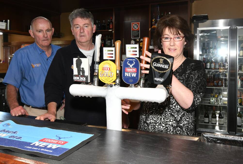 FAREWELL: Siblings Bill and Mark Kelly and Melissa Englert at Kelly's Rugby Hotel on Monday as the pub starts its last week of trading after 96 years.  Photo: CARLA FREEDMAN