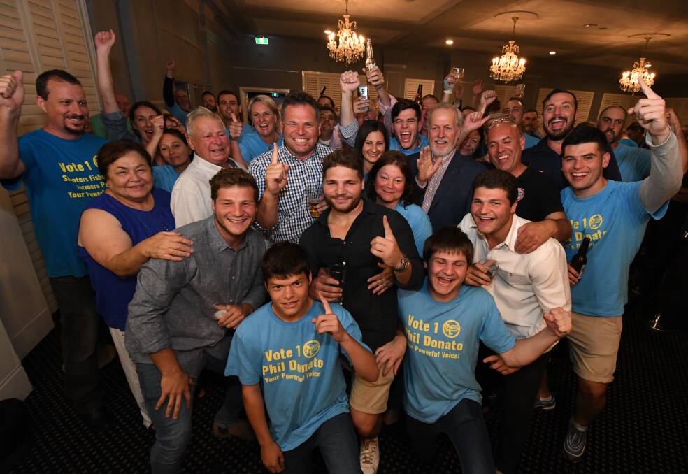 PARTY TIME: Returned member for Orange Phil Donato with his family, friends and supporters after Saturday's election win. Photo: JUDE KEOGH