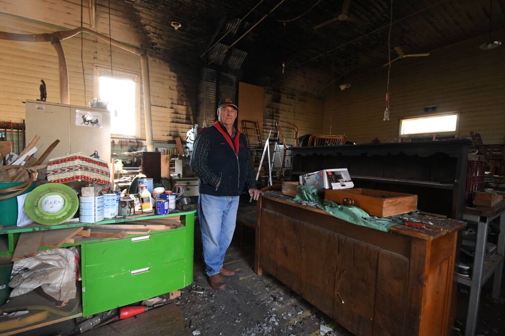 FIRE: Men's Shed chairman Hugh Laird examines the damage. Photo: CARLA FREEDMAN