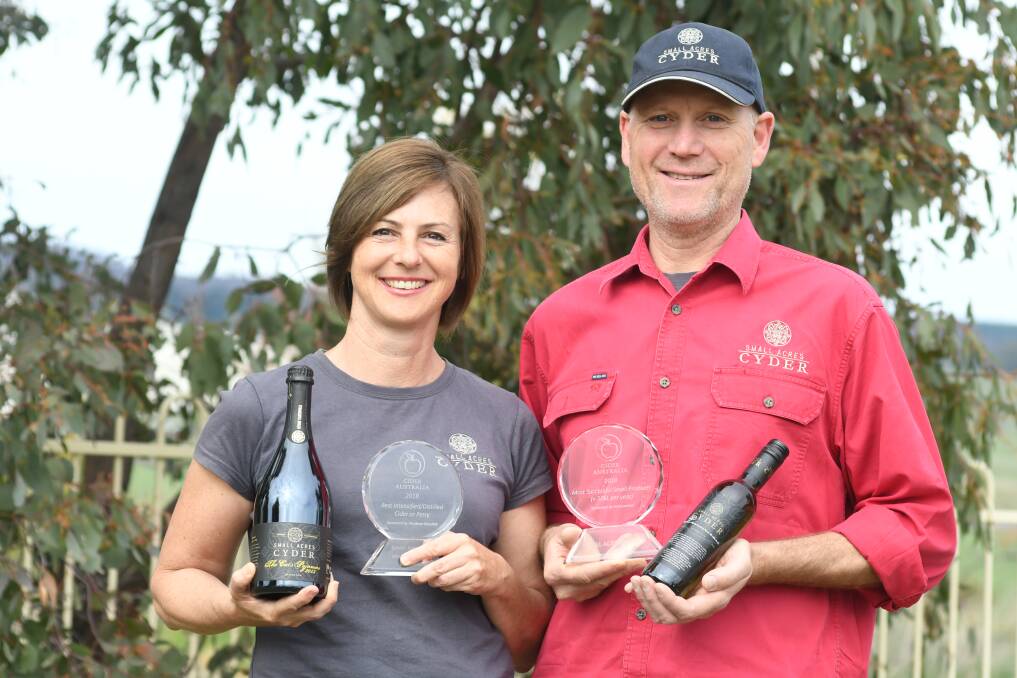 WINNERS: Gail and James Kendell celebrate winning the Most Successful Small Producer trophy at the Australian Cider Awards for the second time. Photo: JUDE KEOGH 1009jkcyder2