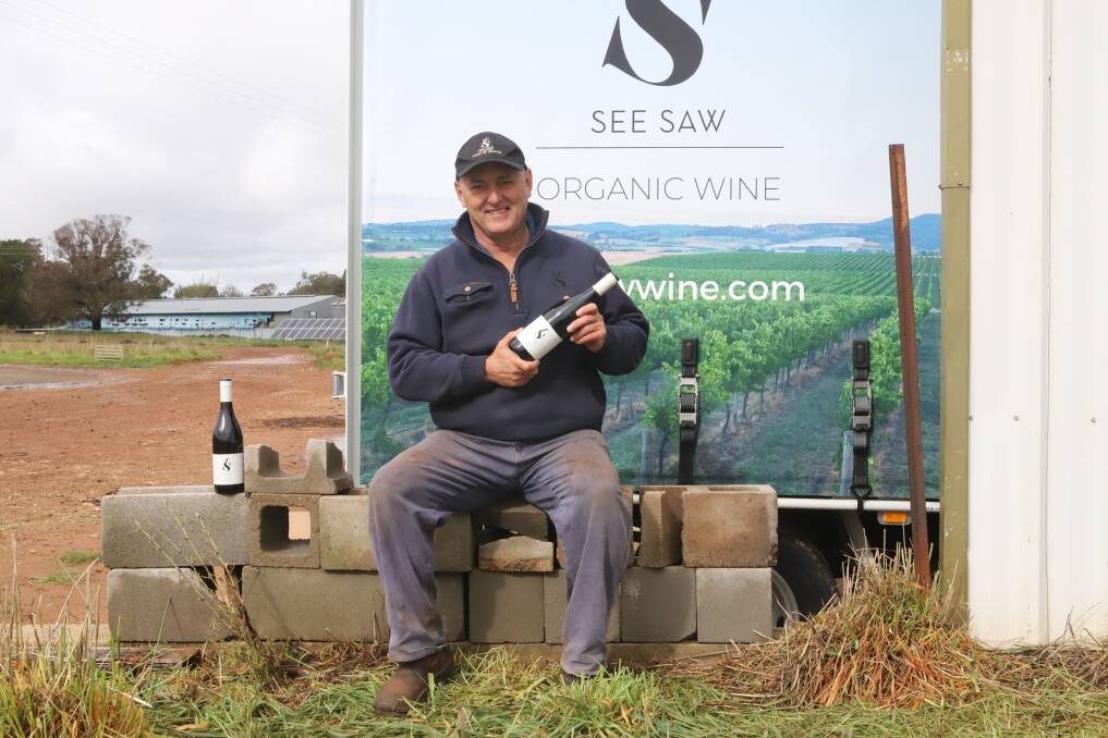 EXPORT DRIVE: Justin Jarrett with some of the wine varieties being exported. Photo: CARLA FREEDMAN