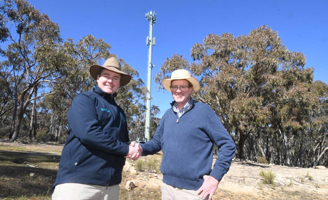 SWITCHED ON: Optus Central West general manager Tom O'Dea with the Member for Calare Andrew Gee at the tower site. Photo: JUDE KEOGH 0813jktower3