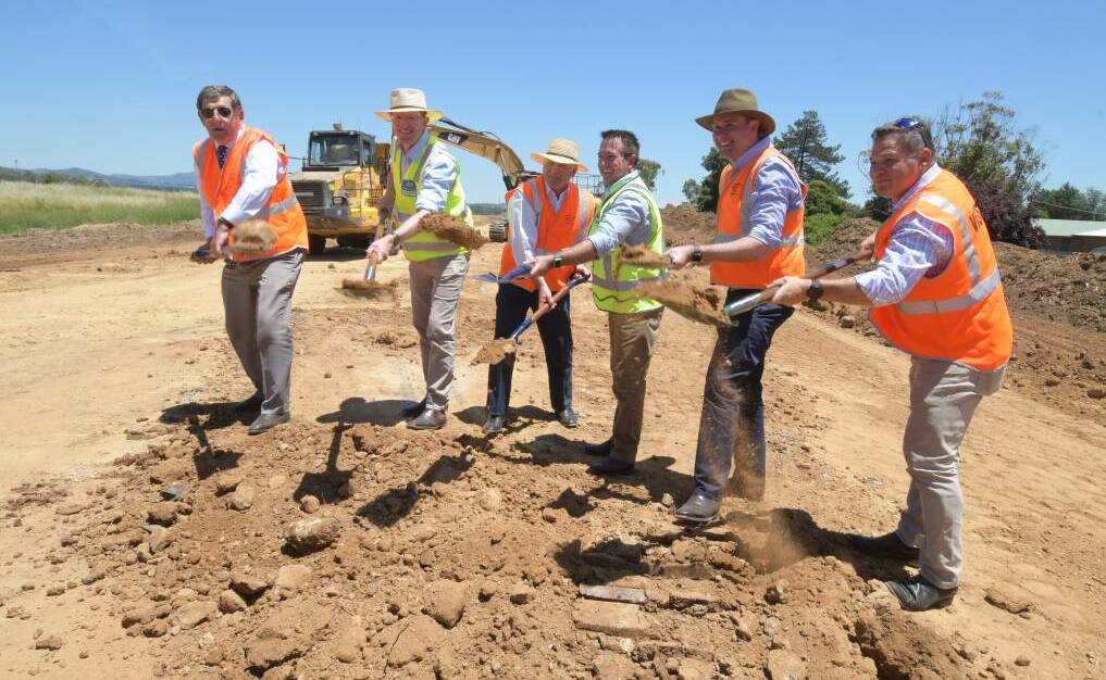 HELPING HANDS: Mayor Reg Kidd, Member for Calare Andrew Gee, Cr Jeff Whitton, Regional Roads minister Paul Toole, Sam Farraway MLC and Member for Orange Phil Donato turn the first sod.