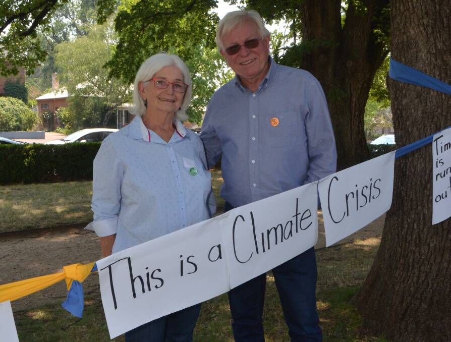 ACTION NEEDED: Kate Allen and Professor Roy Tasker at the Extinction Rebellion meeting in Cook Park on Sunday attended by about 50 people. Photo: DAVID FITZSIMONS