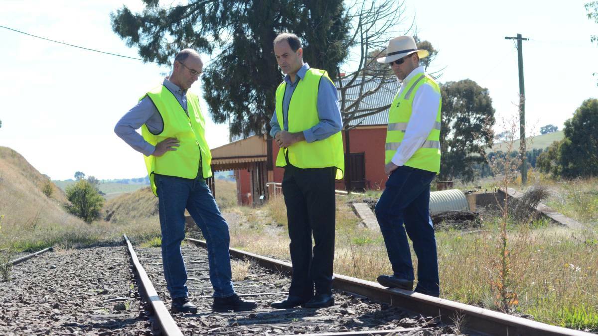 CALL FOR ACTION: Blayney mayor Scott Ferguson, rail study group CEO Stuart Sutherland and Grant Baker at Carcoar railway station in 2017.