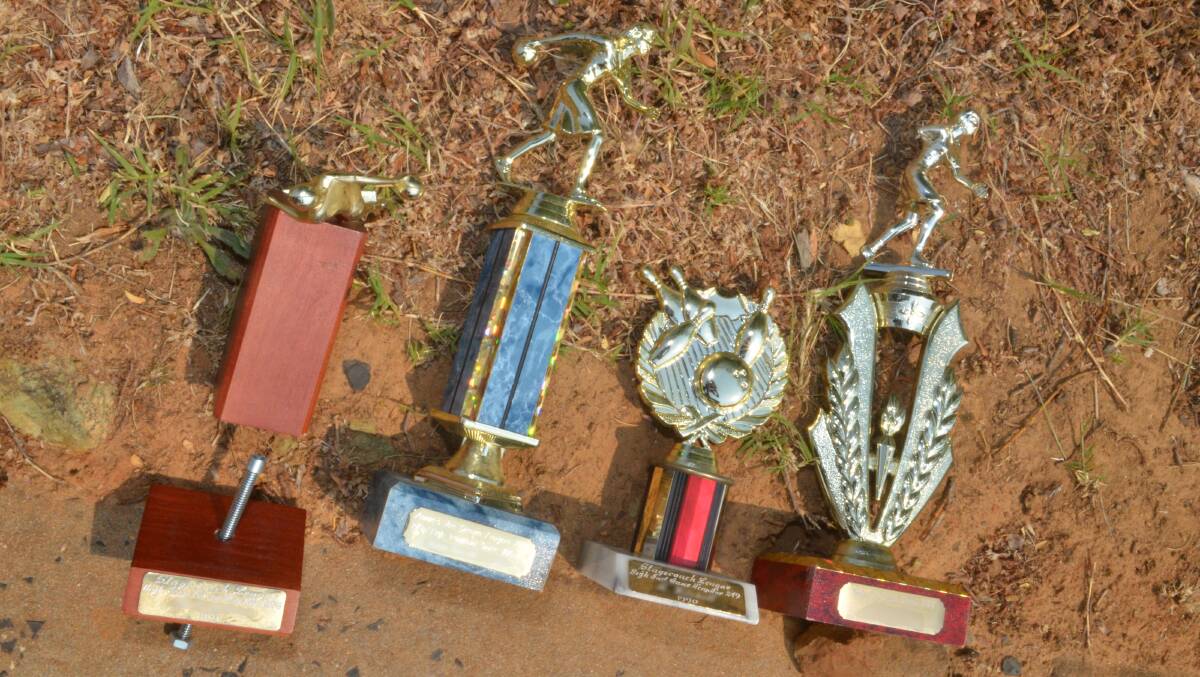 PRIZE RUBBISH: These trophies were among rubbish dumped on Cameron Place.