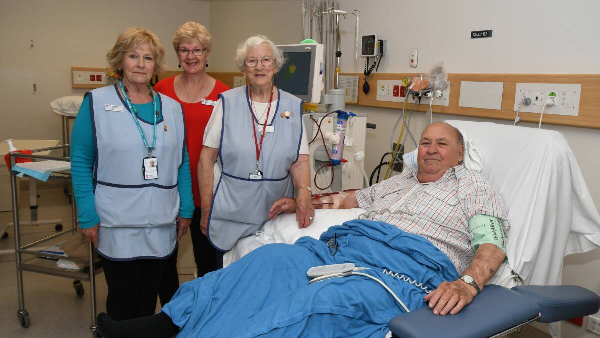 HELPING OUT: Volunteers Carolyn Fitzgerald, Debi Finlay and Dorothy Brown with patient, former Orange mayor, Tim Sullivan, at Orange hospital which is looking to have more volunteers. Photo: JUDE KEOGH 1121jkvol1