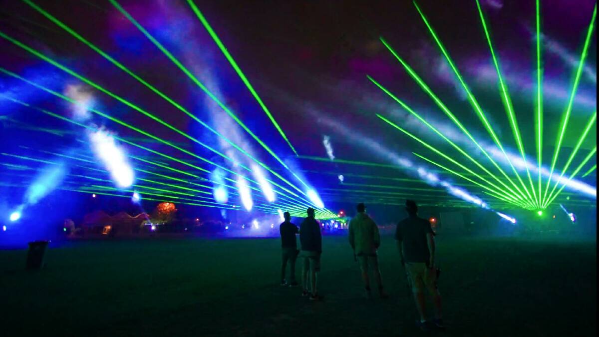 COLOURFUL SIGHT: Lasers blaze across Wade Park in a test run. Photo: EYETRIX