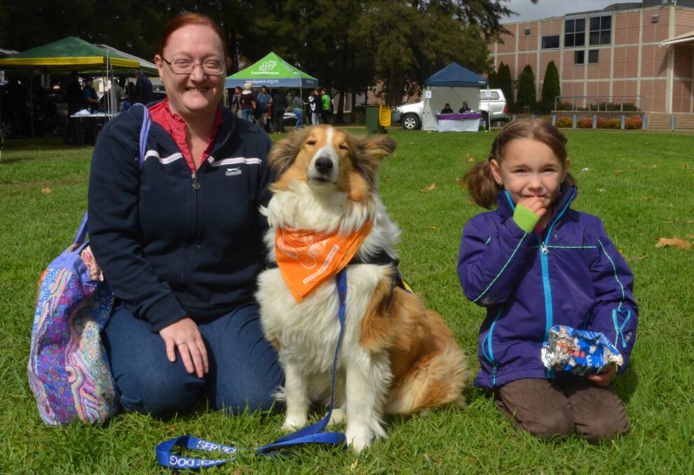 HAPPIER DAYS: Kelly Routh with her assistance dog Pippa and her daughter Joanna, 6, at the Bark in the Park event on Sunday. Photo: DAVID FITZSIMONS 0415dfdog1