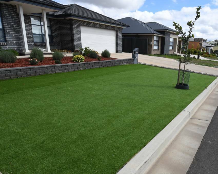 GREEN GRASS: Future laying of artificial turf such as this laid at a house in north Orange would be banned by council. Photo: JUDE KEOGH