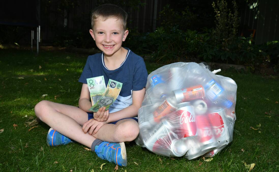 REWARDING: Charlie McLaughlin shows off part of his earnings from recycling cans and bottles. Photo: CARLA FREEDMAN 1129cfrecycle1