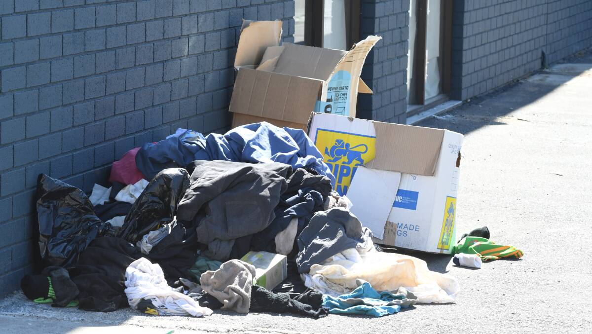 RUBBISH: Old clothes dumped in McNamara Street this week. Photo: JUDE KEOGH