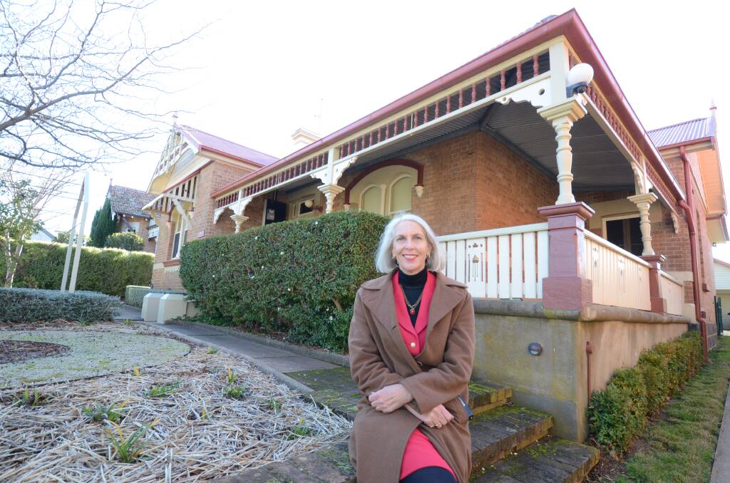 MILLION DOLLAR LIVING: Real estate agent Doone Grist outside the Byng Street property for sale. Photo: JUDE KEOGH
