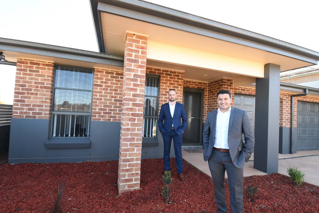 ON THE MONEY: Real estate agents Tom Figuero and Adam Scimone at the Hill Street villa. Photo: JUDE KEOGH