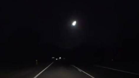 BRIGHT: The meteor is spotted by a motorists travelling on the Escort Way. Photo: DAVID BELL/YOUTUBE