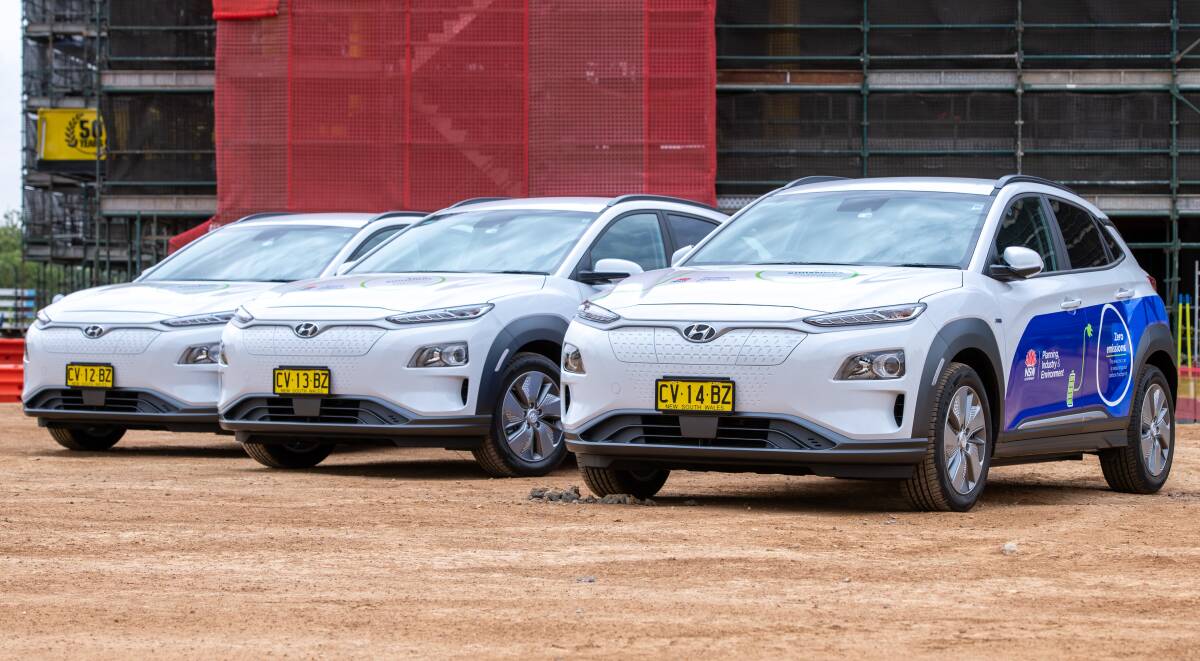 FUTURE: The electric car fleet at the new DPI headquarters under construction. Photo: Supplied, Rachel Gordon.