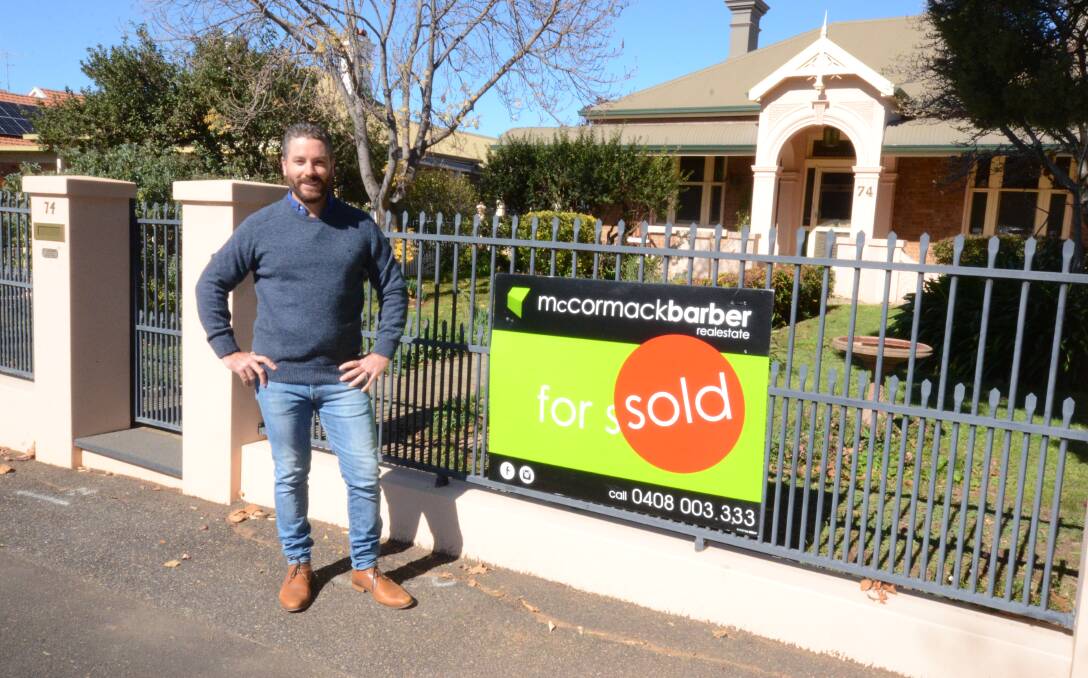 SOLD: Real estate agent Peter McCormack at 74 Byng Street. Photo: JUDE KEOGH