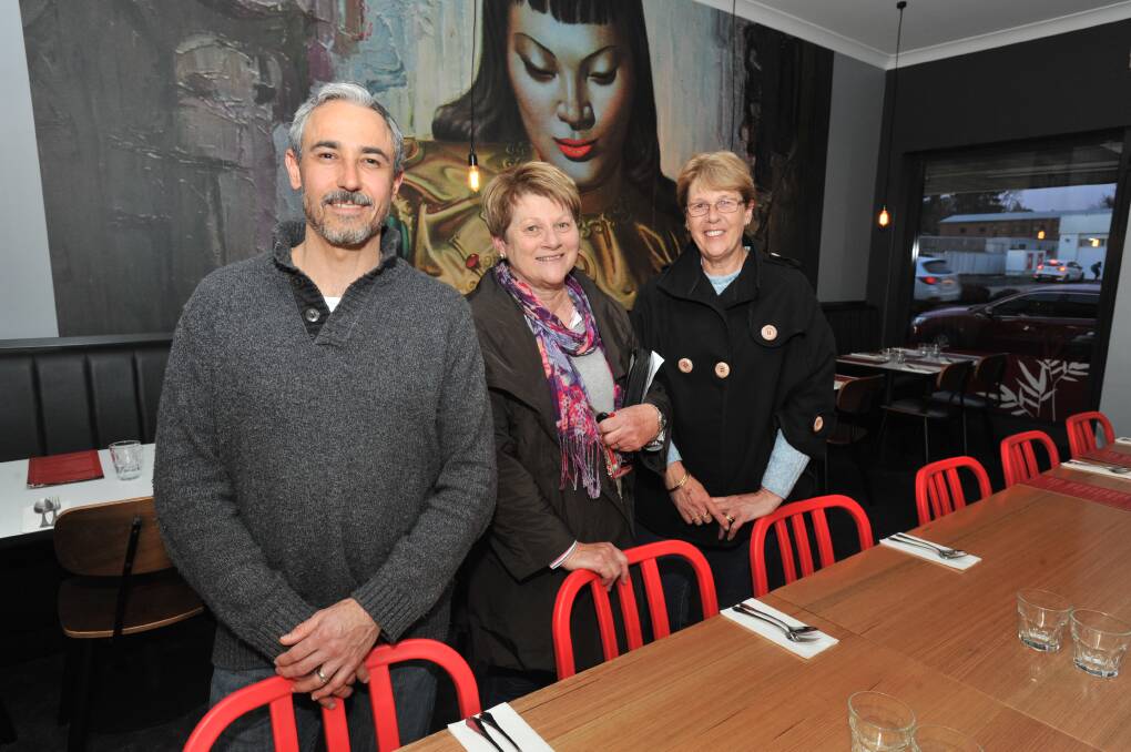 SAVING GRACE: Sweet Sour Salt owner Ivan Podres with voucher holders Bev Hutchinson and Sue Gentles. Photo: JUDE KEOGH 0811jksweetsour1