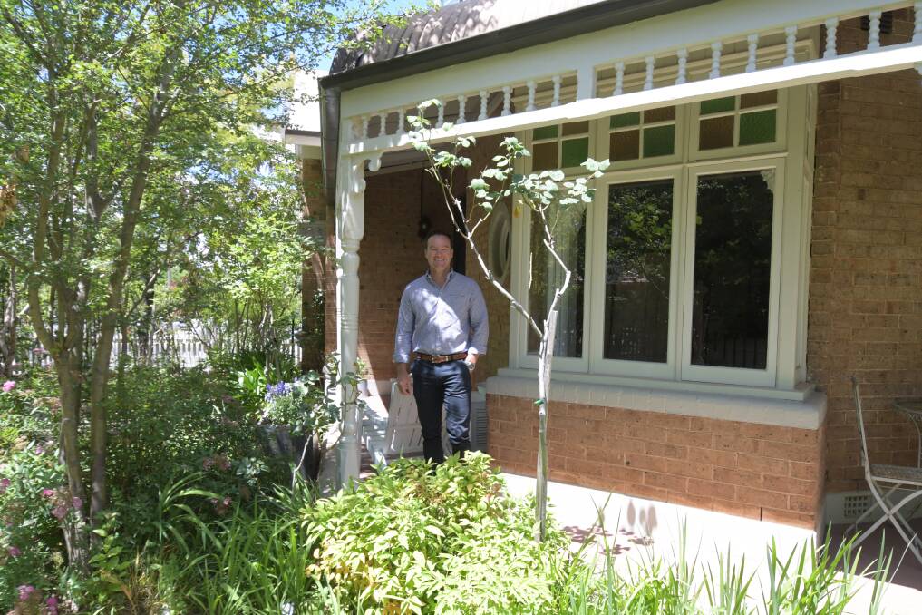 FOR SALE: Real estate agent Josh Fitzgerald at 9 Sale Street which is on the market. Photo: CARLA FREEDMAN