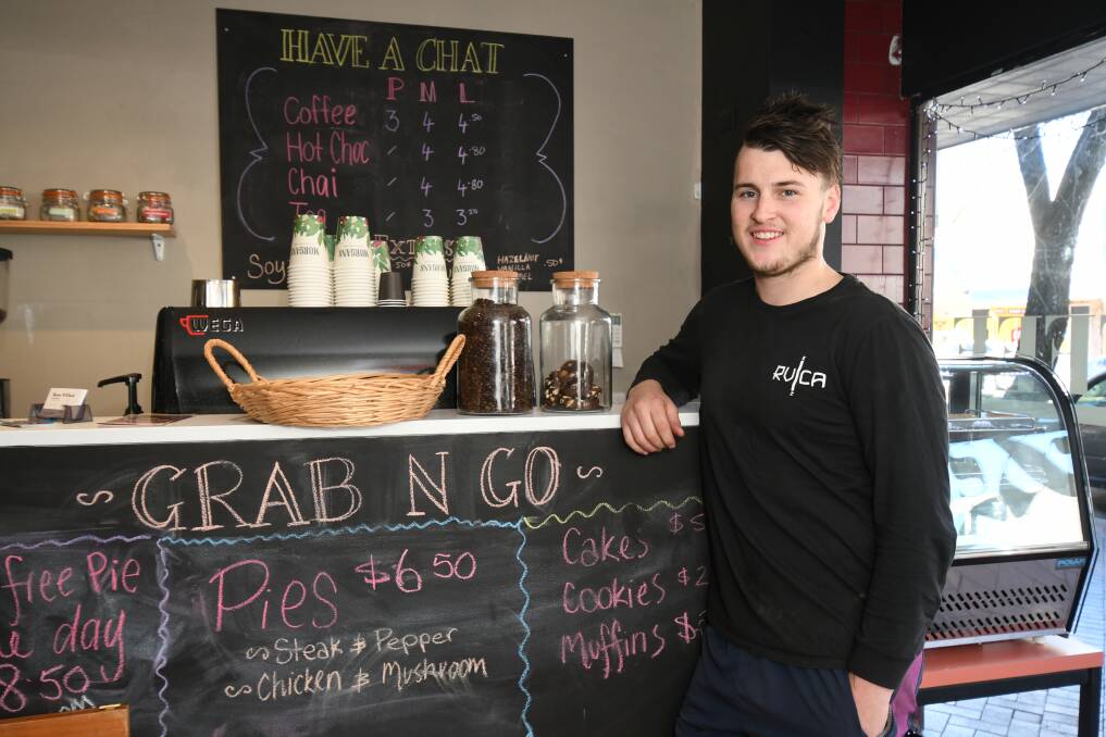 NOW OPEN: Barista Chris Rothnie in the new Have A Chat coffee shop in Summer Street. Photo: JUDE KEOGH 0727jkhaveachat1