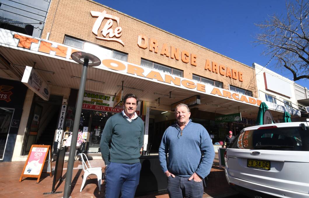 HISTORIC SITE: Real estate agents Nigel Staniforth and David Hall outside the front of The Orange Arcade which is up for sale. Photo: JUDE KEOGH