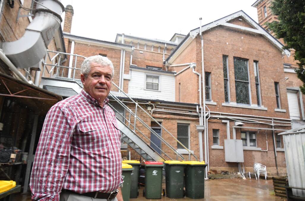 THE OTHER SIDE: John Cook at the rear of Duntryleague where an extension is planned and near where an interior lift would be built under current plans. Photo: JUDE KEOGH