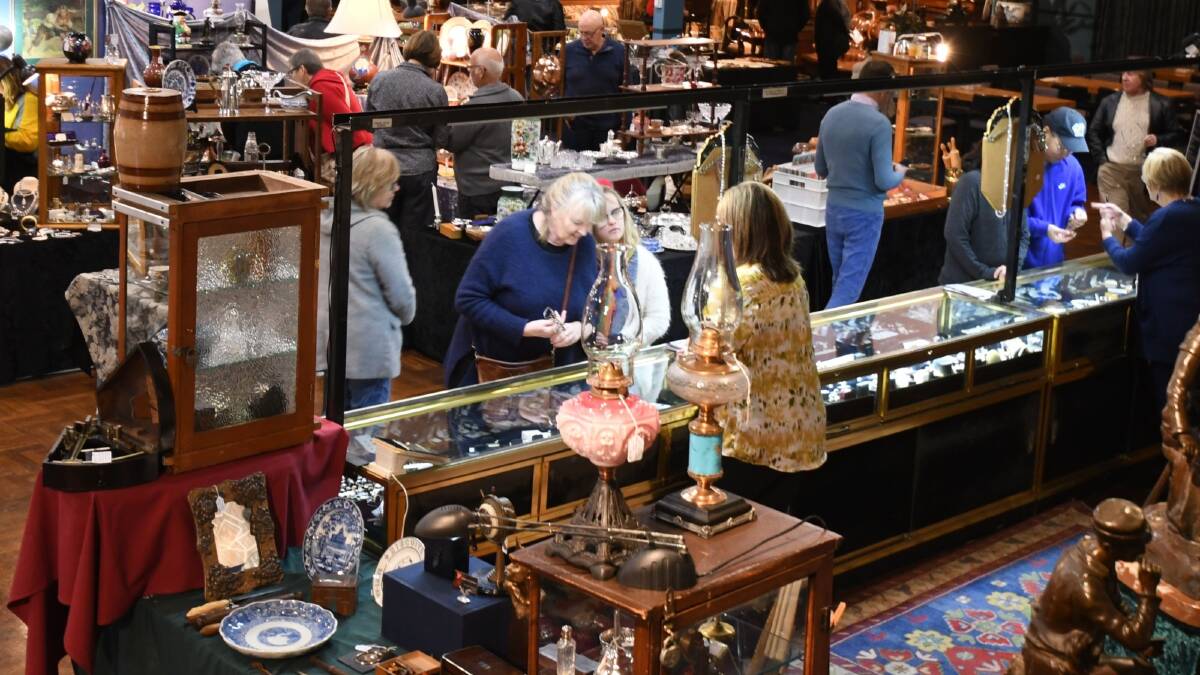BARGAIN HUNTERS: Judy and Jessica Hockey inspect jewellery items at a stall at the weekend's Orange Antique Fair at the Orange Function Centre. Photo: CARLA FREEDMAN