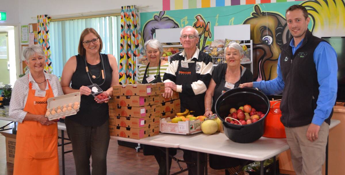 HELPING OUT: Jenny Maxey, Kate Bracks, Marion Jaques, Roger Tarrant, Robyn Ellis and Elliot Redwin at Foodcare Orange. Photo: DAVID FITZSIMONS 1204dffood3