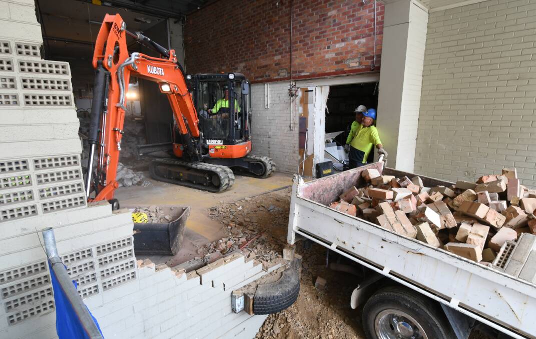 IT'S UNDERWAY: Demolition workers have moved 
into the old Myer store to begin work to redevelop 
the site. Photo: JUDE KEOGH 1114jkmyer4