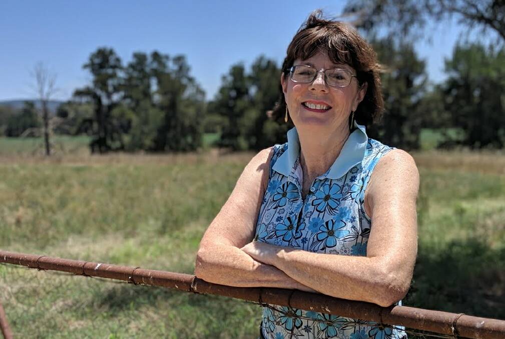READY TO STAND: Kate Hazelton, at her farm gate, is the only nomination for the Nationals for the state seat of Orange. Photo: Supplied